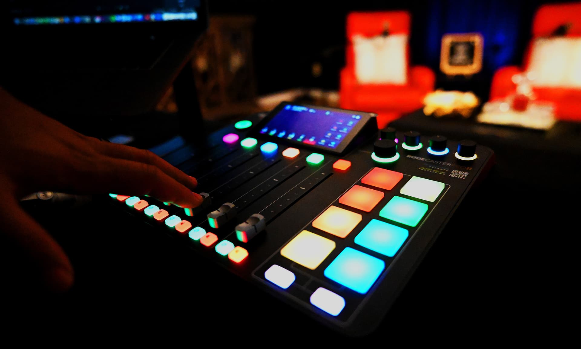 Hand operating the Rodecaster Pro mixing board